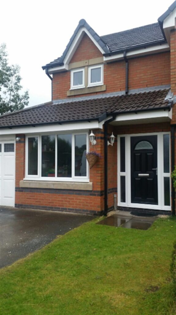 White UPVC windows with black composite front door 4